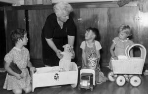 Matron Miss L Johnston, known as Miss Johnny, plays with children at Abbotsford in Waipawa.