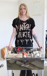 Rebecca Frances Lees with “found objects” for her art.