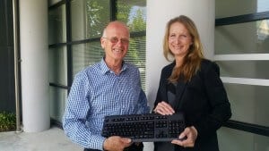 Dr Stephen Corich makes a symbolic handover to Rebekah Dinwoodie, the new head of EIT’s computing school.