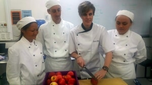 Jenna White works with Hawke’s Bay-grown produce with EIT trainee chefs, from left, Atsuko Nakai, Matthew Rose and Awaitopea Lloyd.