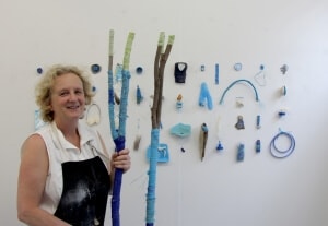 ideaschool student Susan Mabin with an assemblage of found objects.